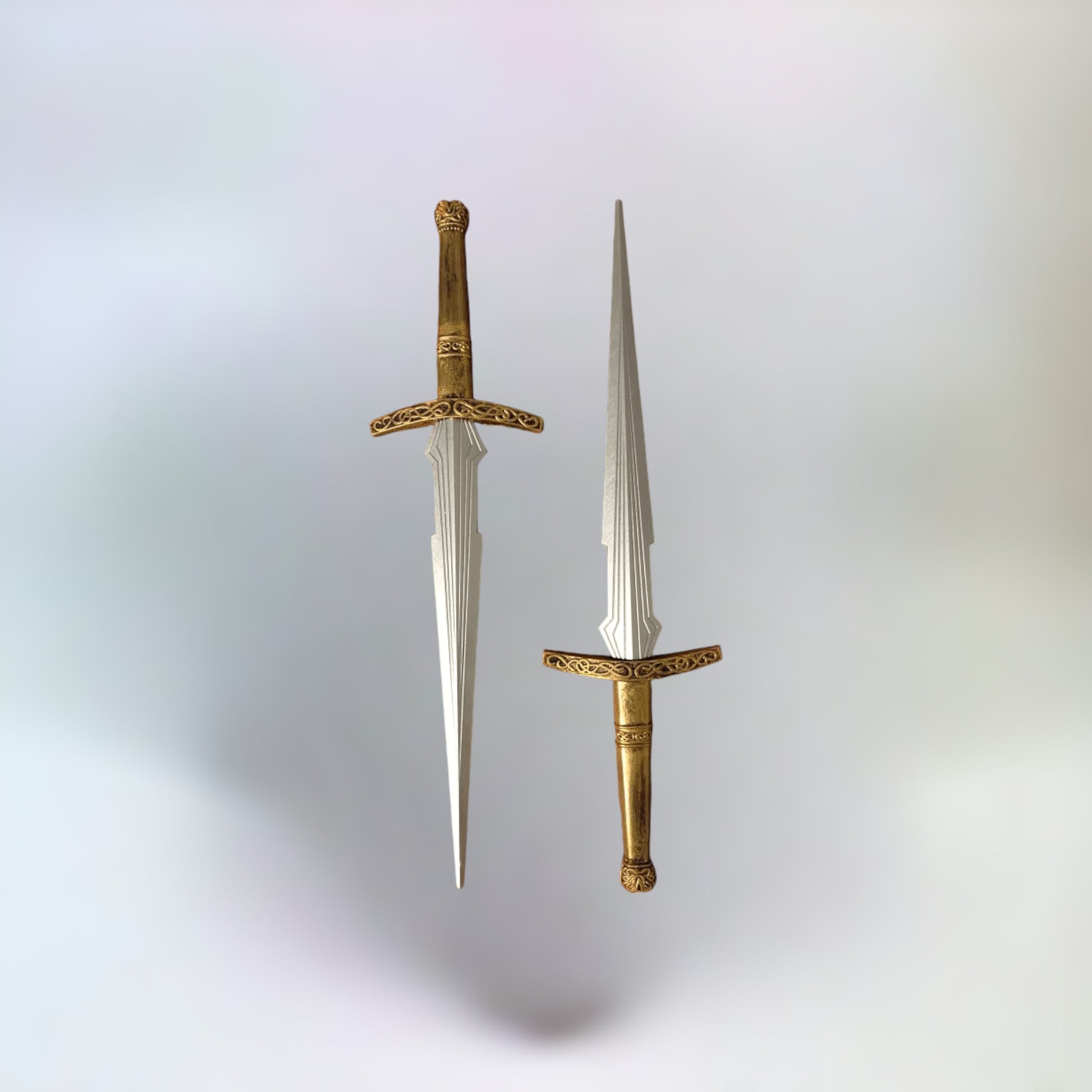 2 Realistic Loki daggers on a plain white background.