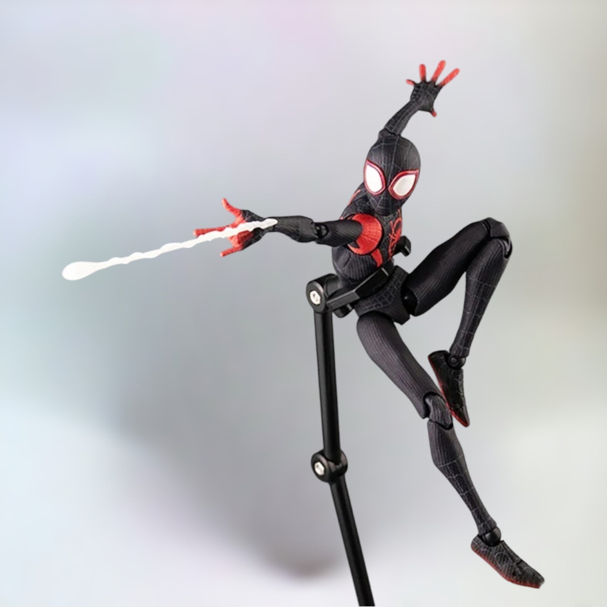 Miles Morales action figure on display stand shooting webs with a plain white background.