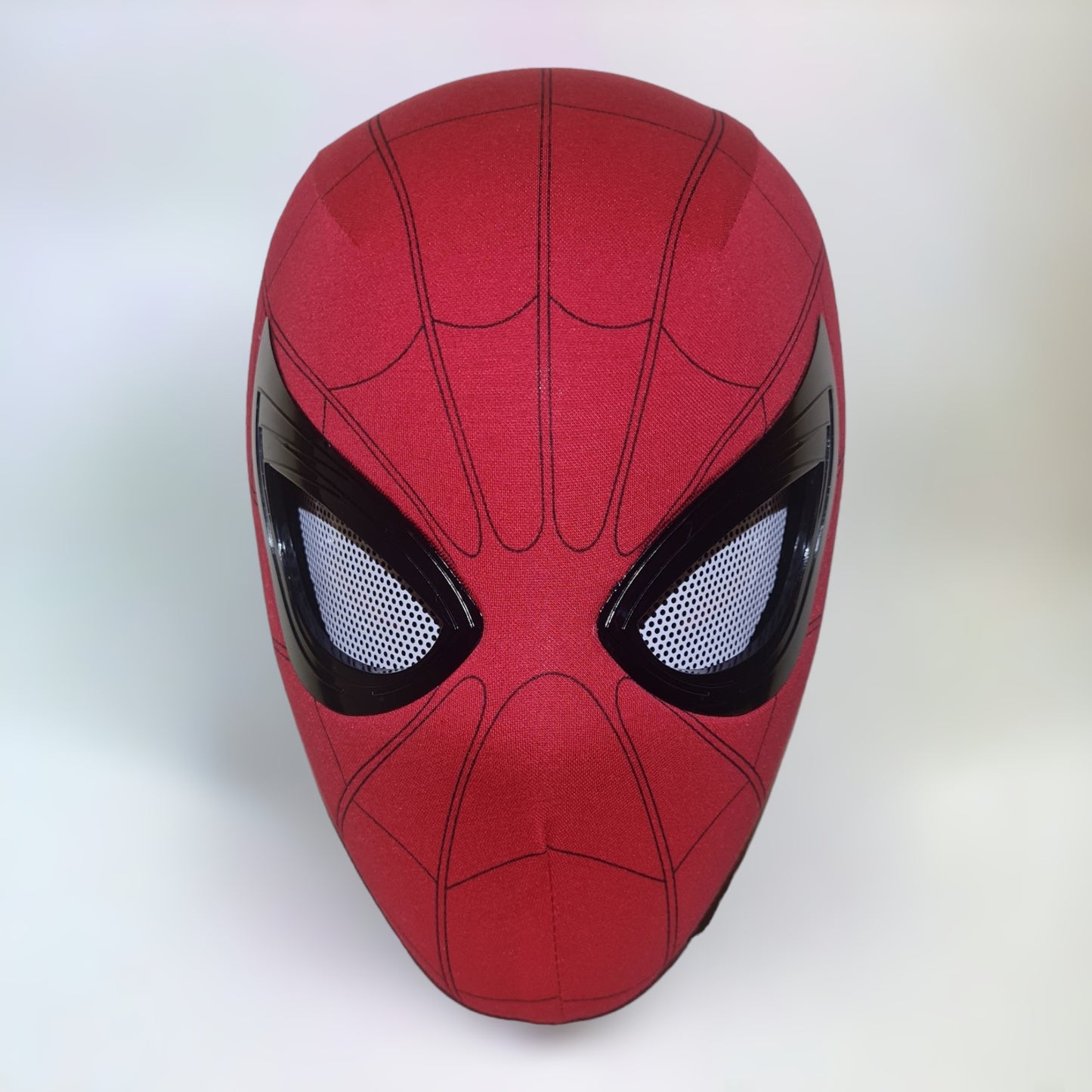 Spiderman mask with blinking movable eyes chin control on a plain white background.