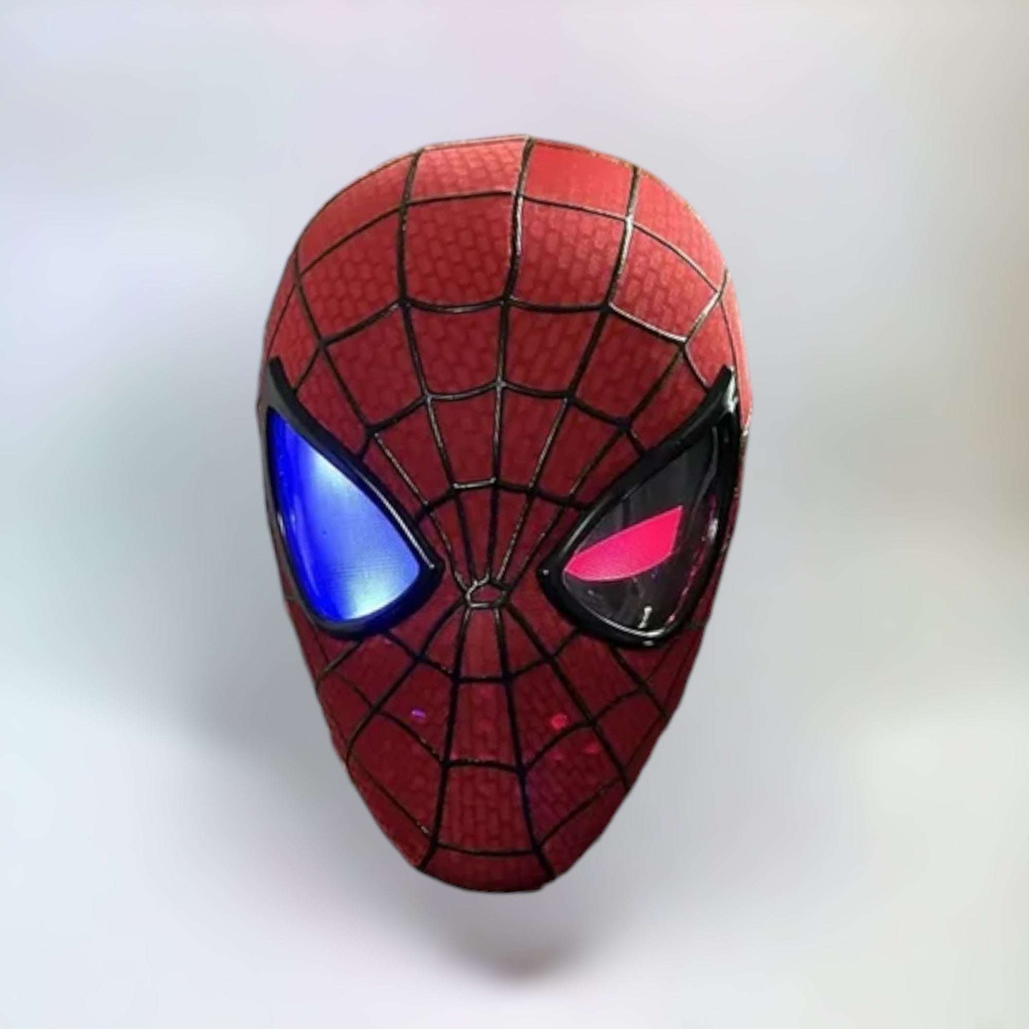 The Amazing Spiderman Mask with Blinking Movable Eyes Remote Controlled and Individually Controlled LED Light Eyes Side View. Spiderman mask with plain white background