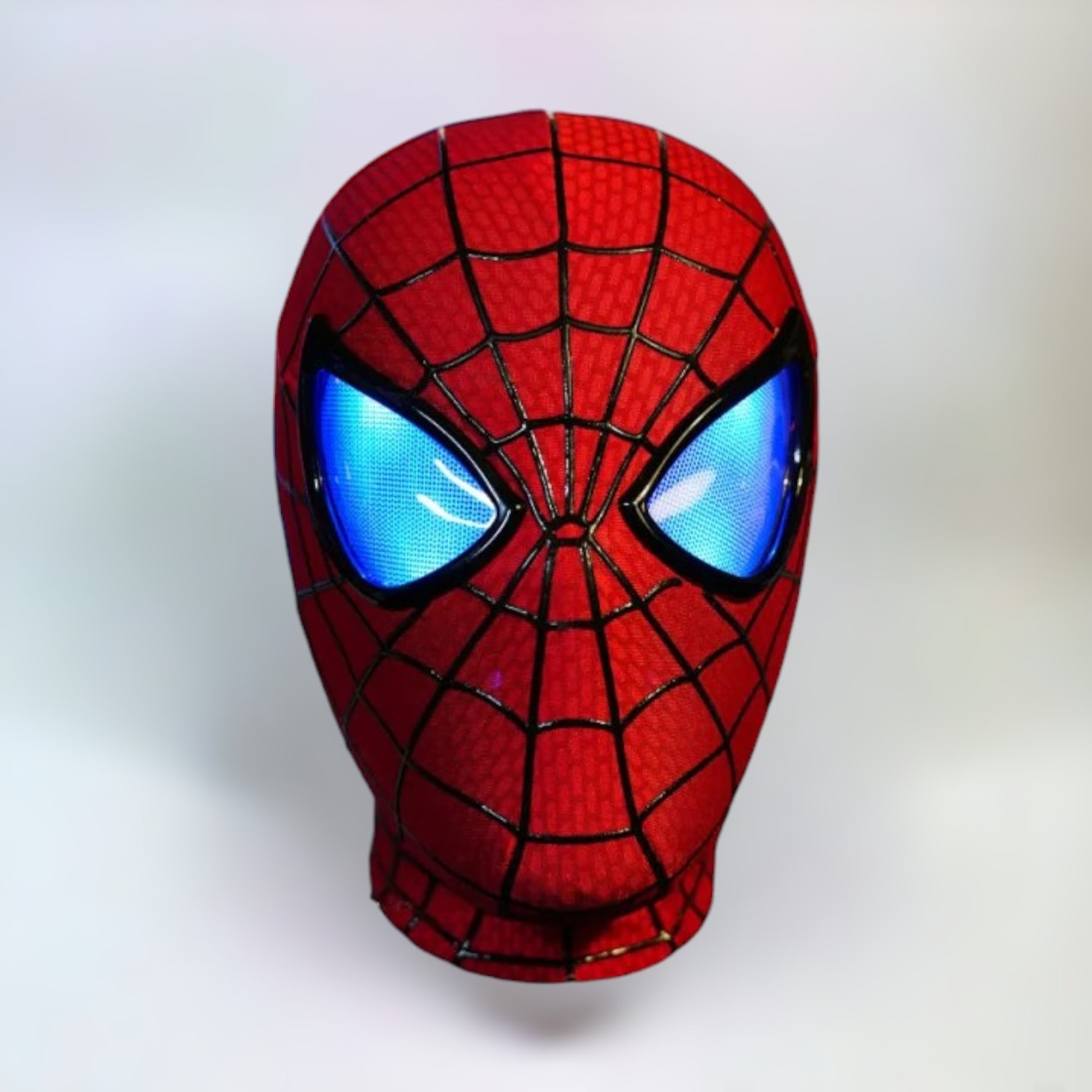 The Amazing Spiderman Mask with Blinking Movable Eyes Remote Controlled and LED Lights Blue LED Eyes Open Spiderman mask with plain white background