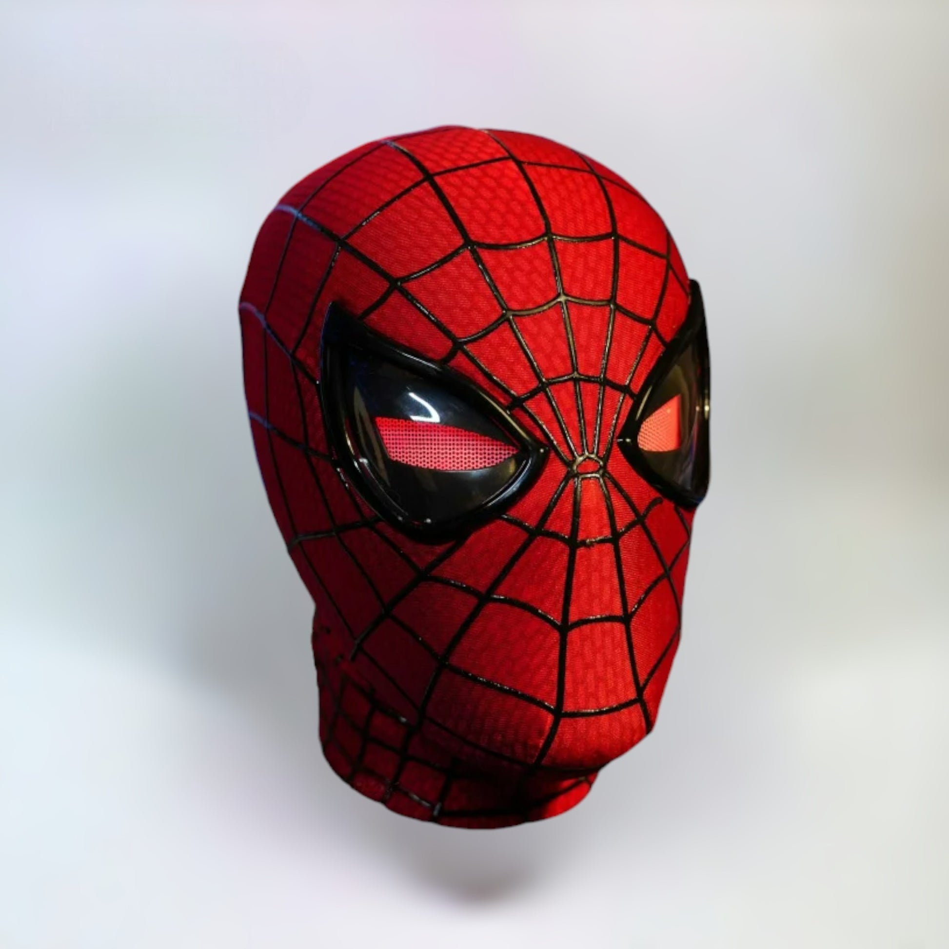 The Amazing Spiderman Mask with Blinking Movable Eyes Remote Controlled and LED Lights Red LED Eyes Closed Spiderman mask with plain white background
