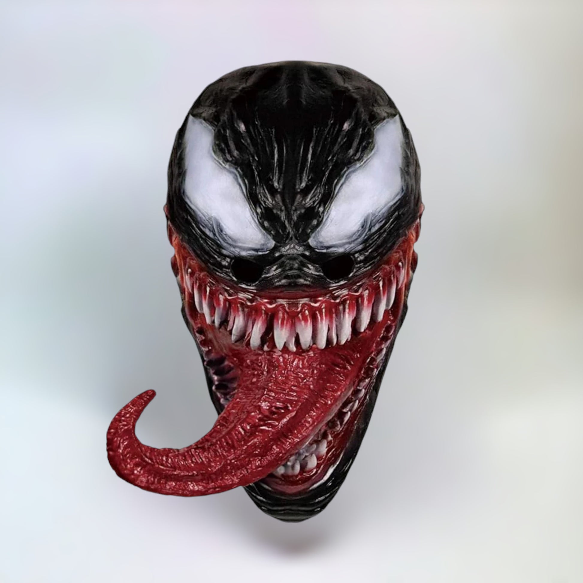 Front view of Venom mask with sharp teeth and detailed grin.