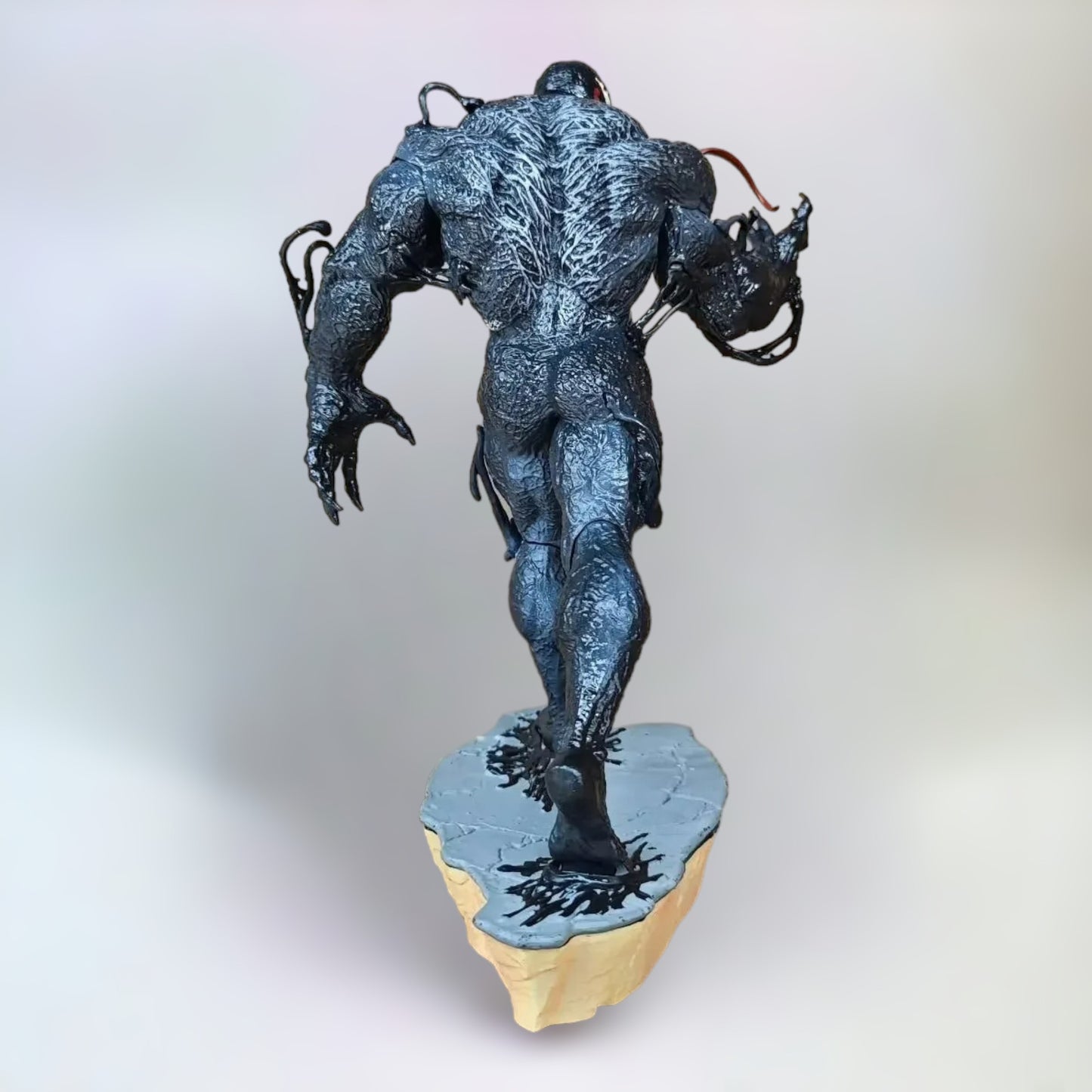Venom Figure The Last Dance. The back side of a 30cm realistic Venom figure with a plain white background.