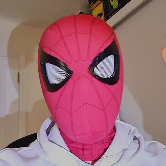 Spiderman mask with movable eyes blinking, remote control being used. Spiderman mask remote control version testing video.